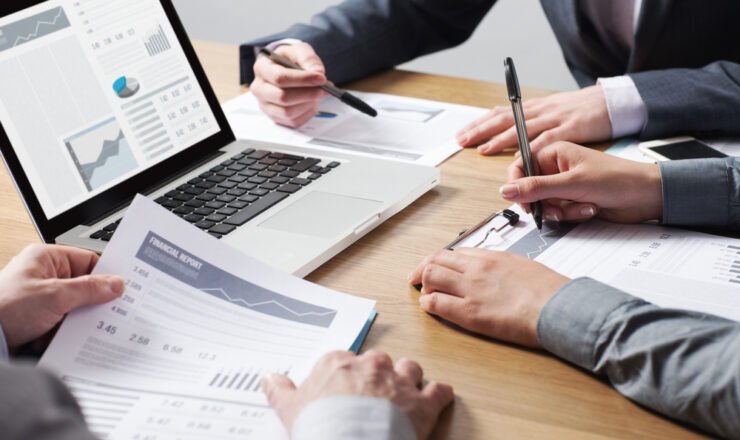 Business,Professionals,Working,Together,At,Office,Desk,,Hands,Close,Up